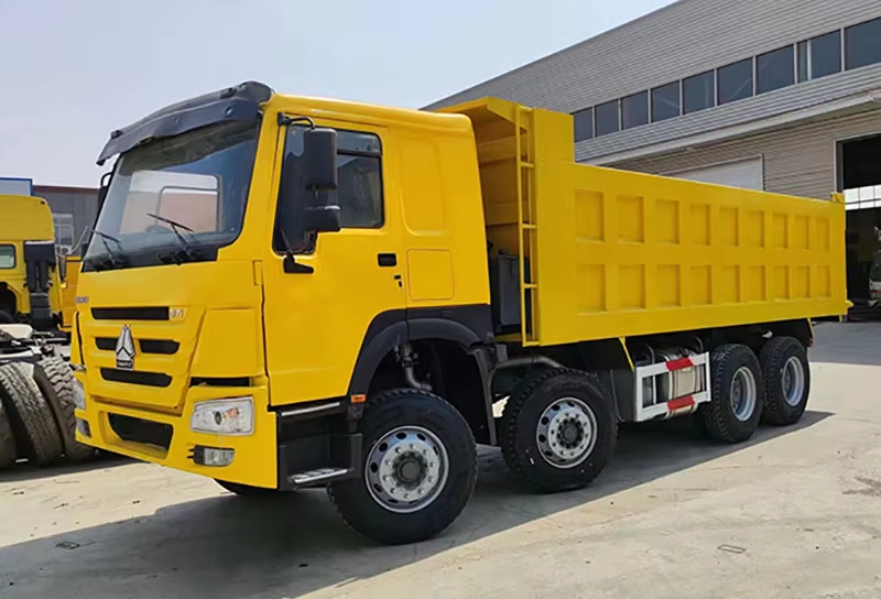 Μεταχειρισμένο Howo Dump Truck 371hp 8x4 Left Hand Drive Engine AC 12 Wheels for Zimbabwe