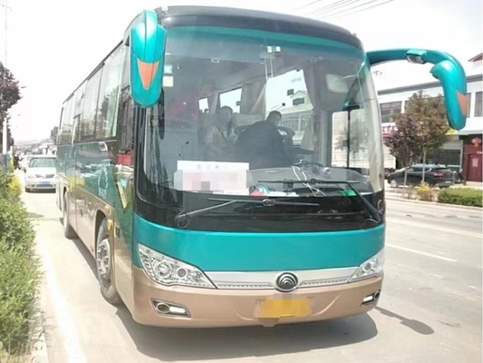 Η χρησιμοποιημένη μηχανή προγυμνάζει το πράσινο χρώμα 36 καθισμάτων μέσο επιβατών πορτών λεωφορείο ZK6906 Yutong χεριών κλιματιστικών μηχανημάτων 2$ο